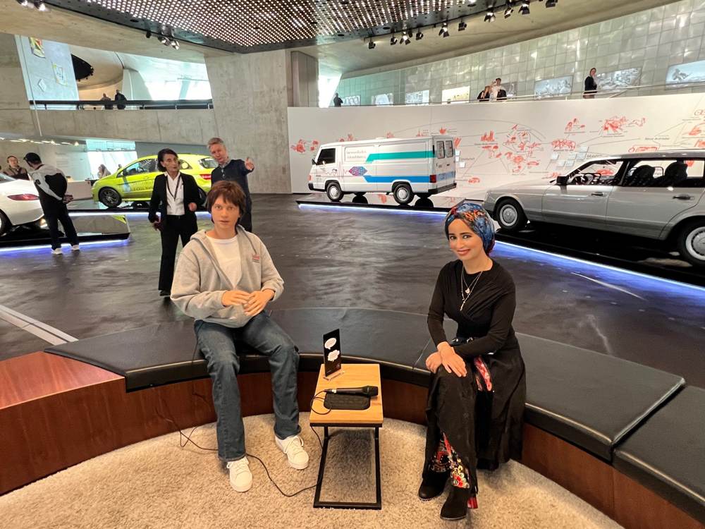 In dialogue with a humanoid android — Mercedes‑Benz Museum, Stuttgart · future‑mobility hall
